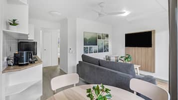 Premier Apartment | Living area | 50-inch flat-screen TV with digital channels, TV