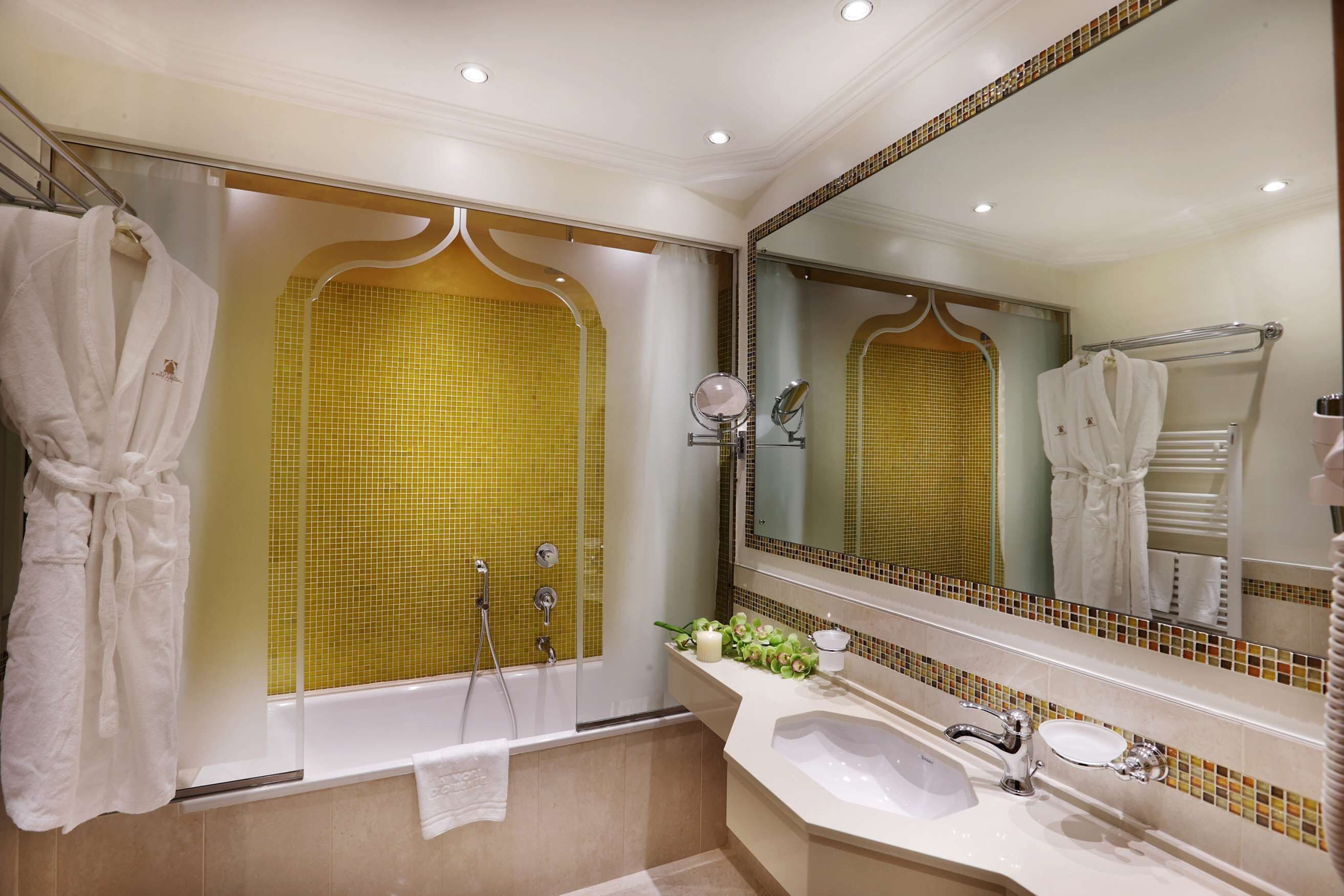 designer toiletries, hair dryer, slippers, bidet