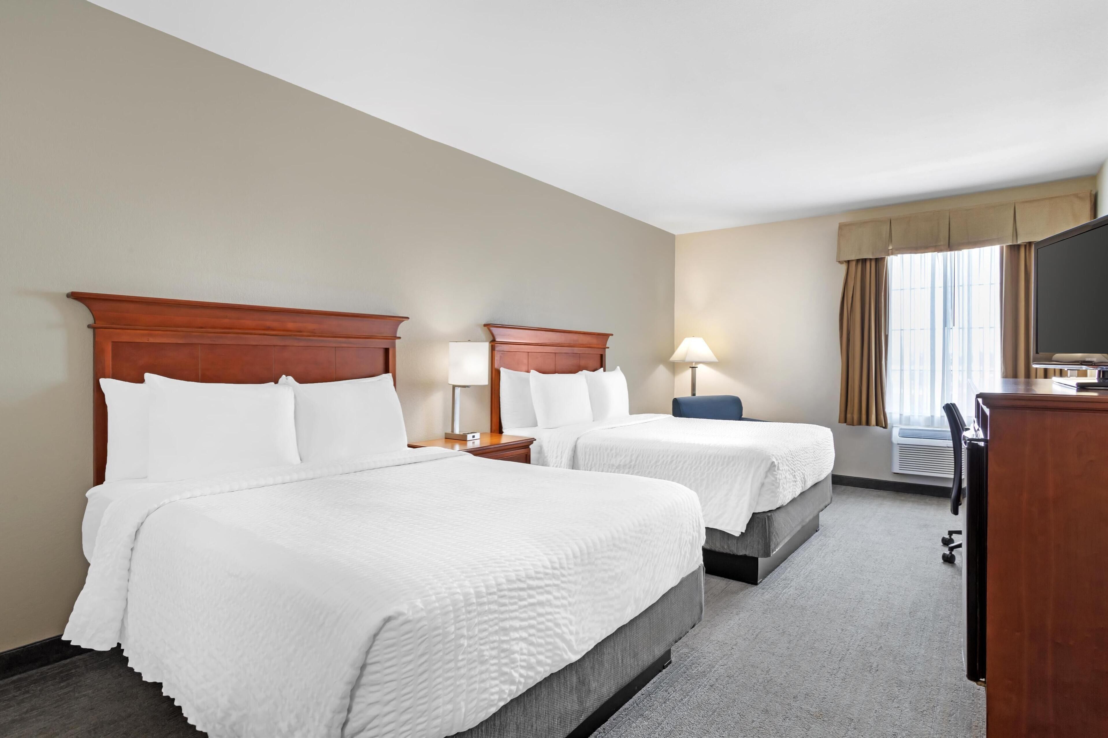 standard room, 2 queen beds, non smoking, refrigerator & microwave | desk, blackout curtains, soundproofing, iron/ironing board