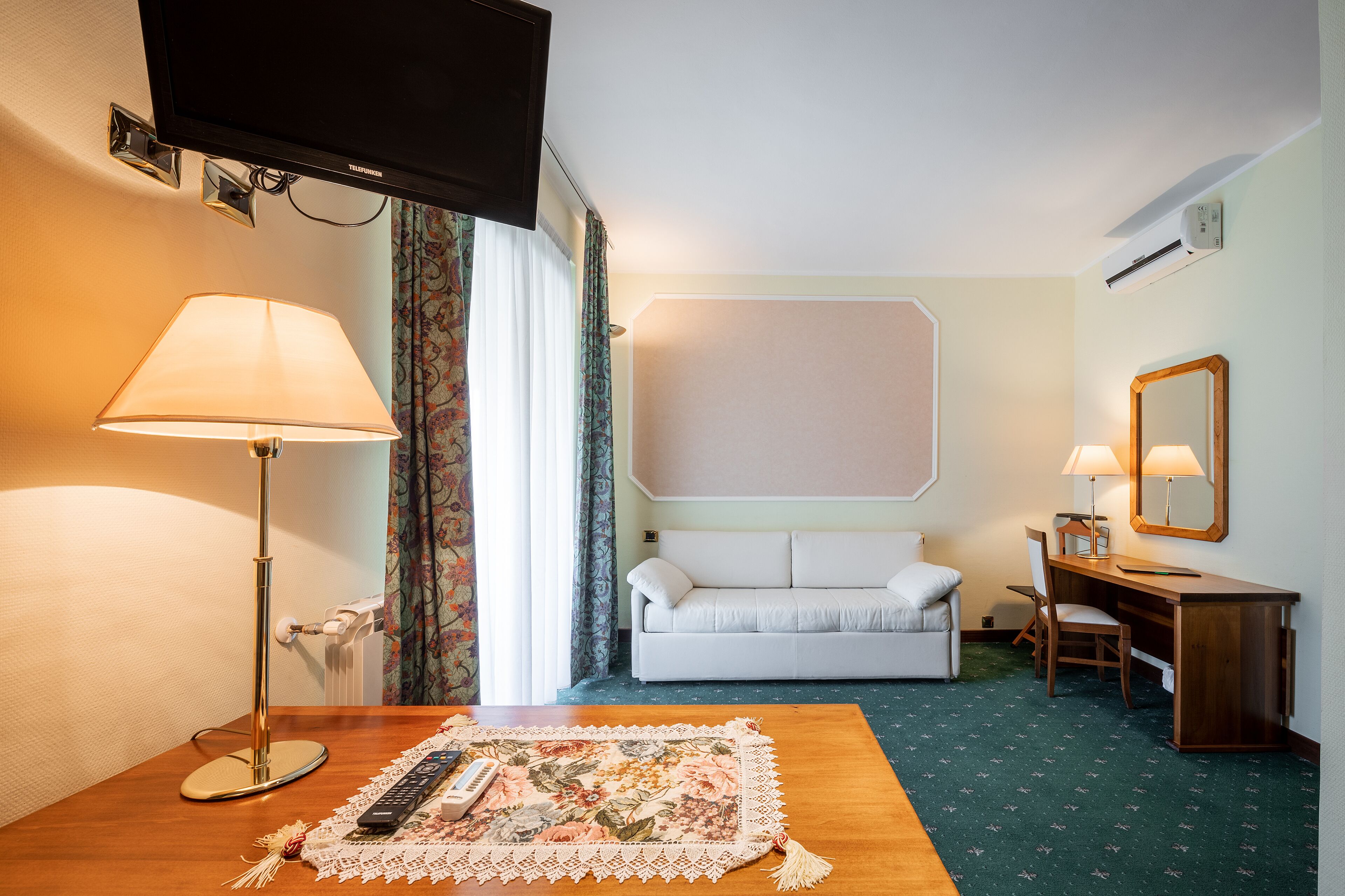 family room | minibar, in-room safe, desk, blackout curtains