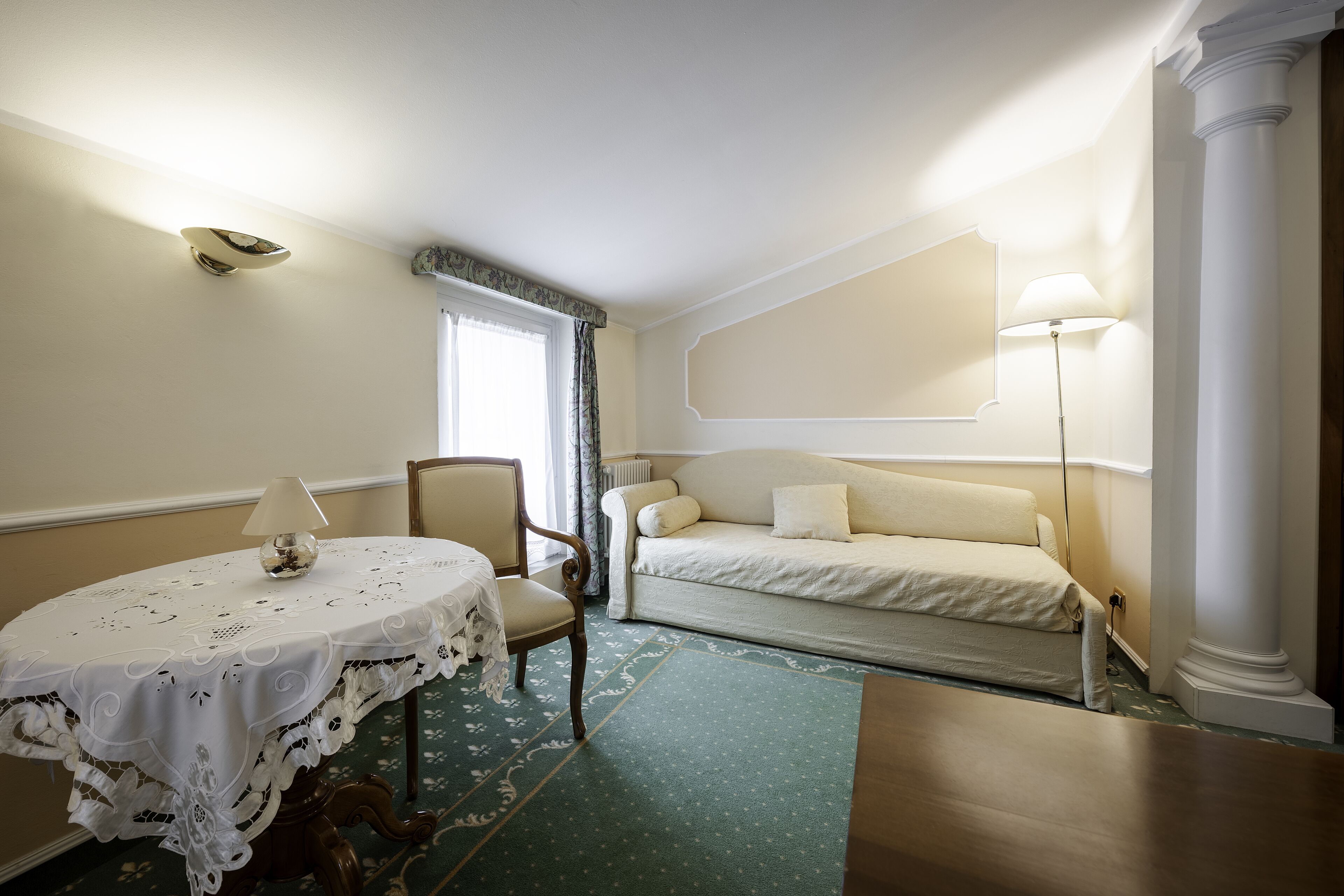 family room | minibar, in-room safe, desk, blackout curtains