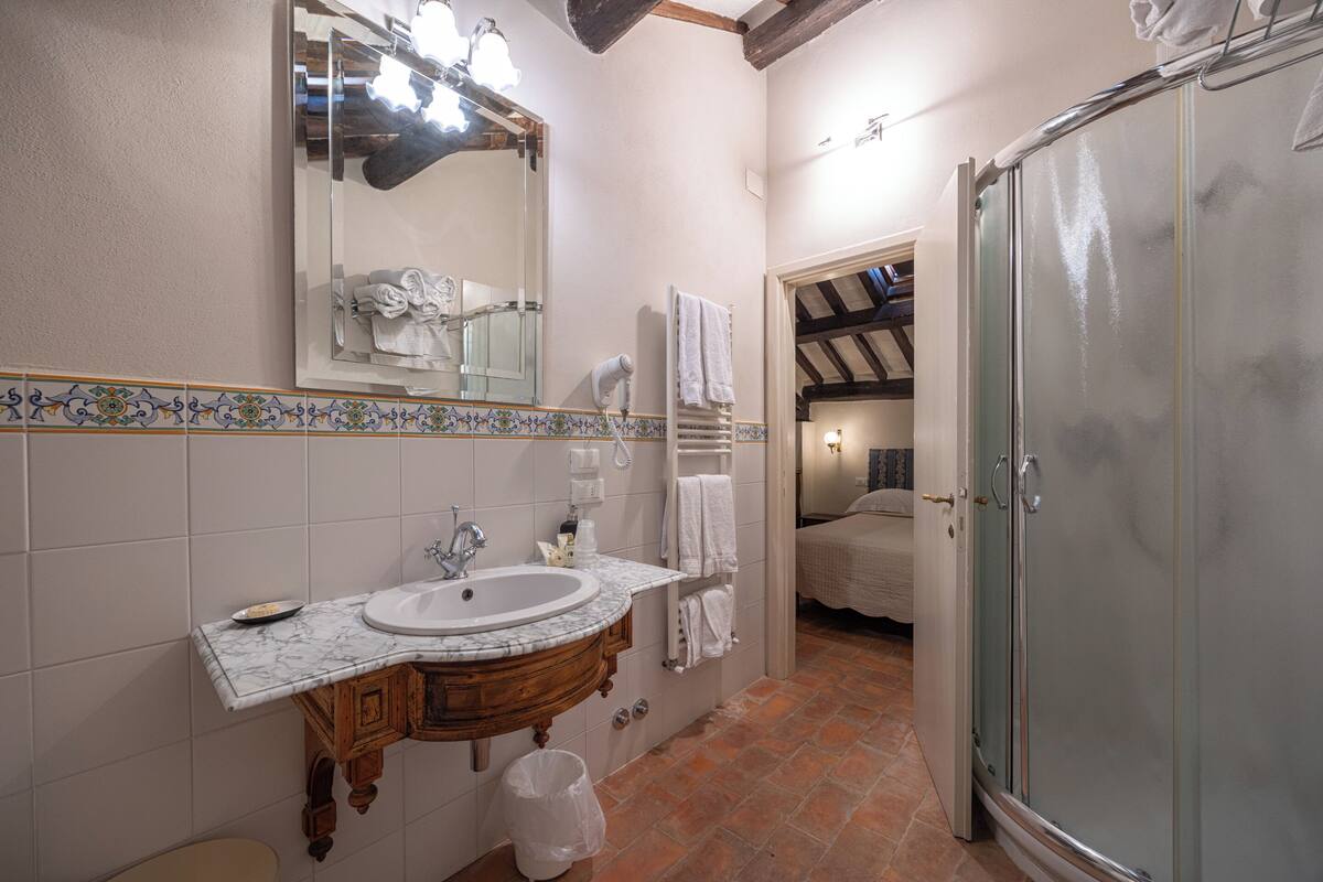 family suite, multiple beds | bathroom | free toiletries, hair dryer, bathrobes, bidet