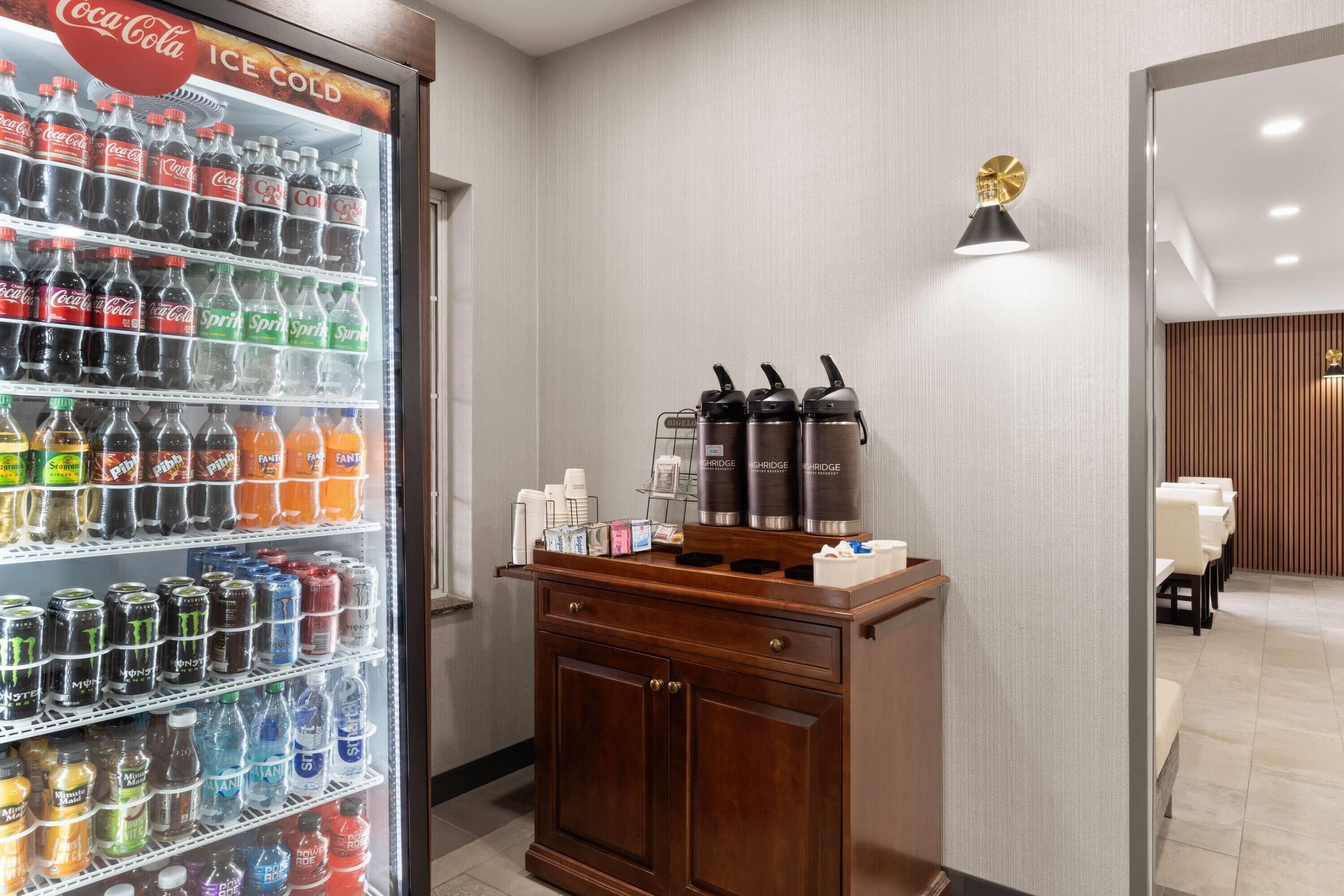 A vending machine with various beverages and a coffee machine.