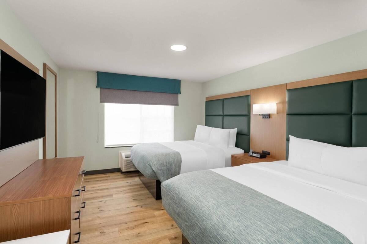 Pillow-top beds, desk, laptop workspace, blackout curtains