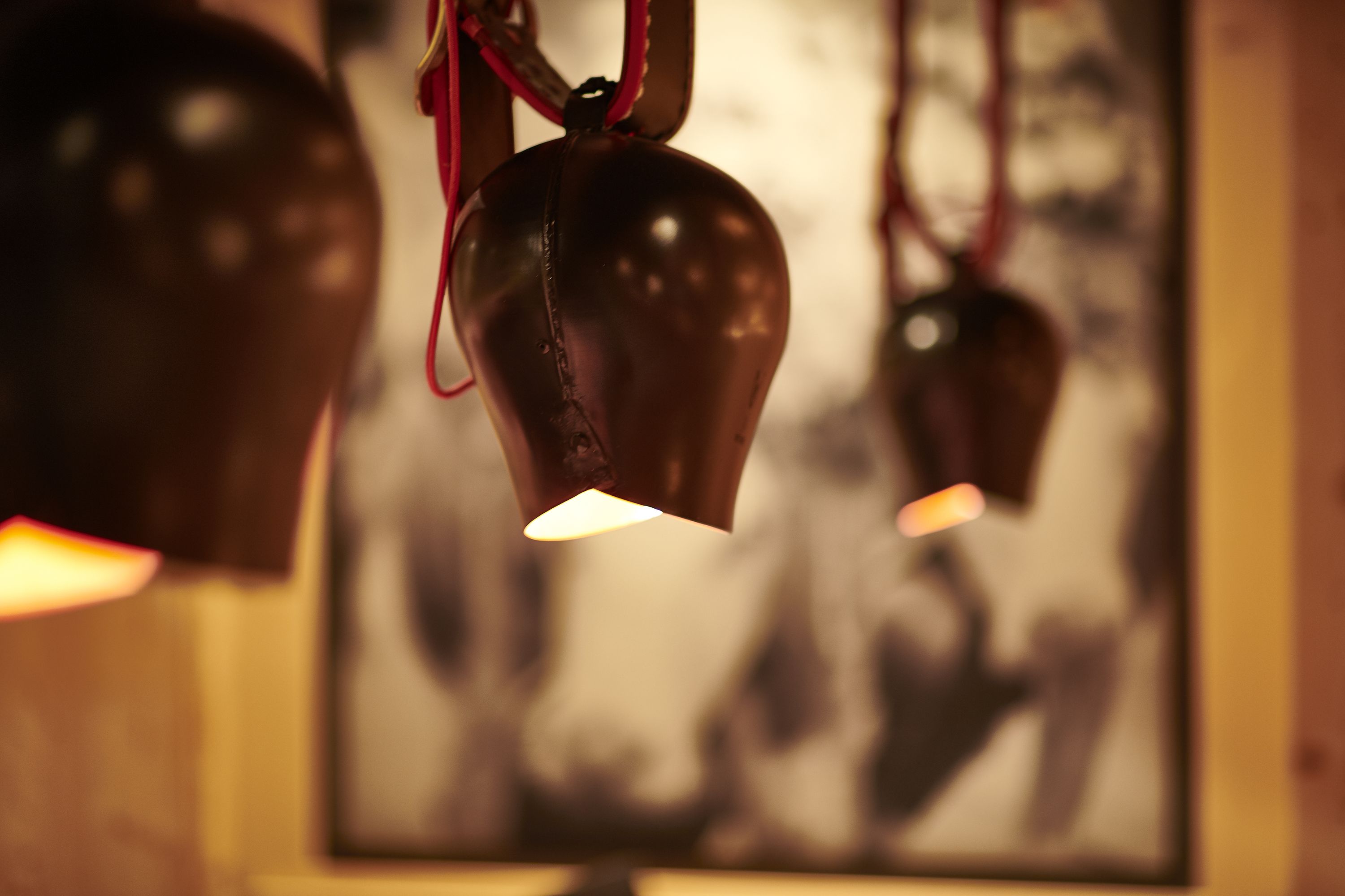 A close-up of hanging light fixtures with a blurred background.