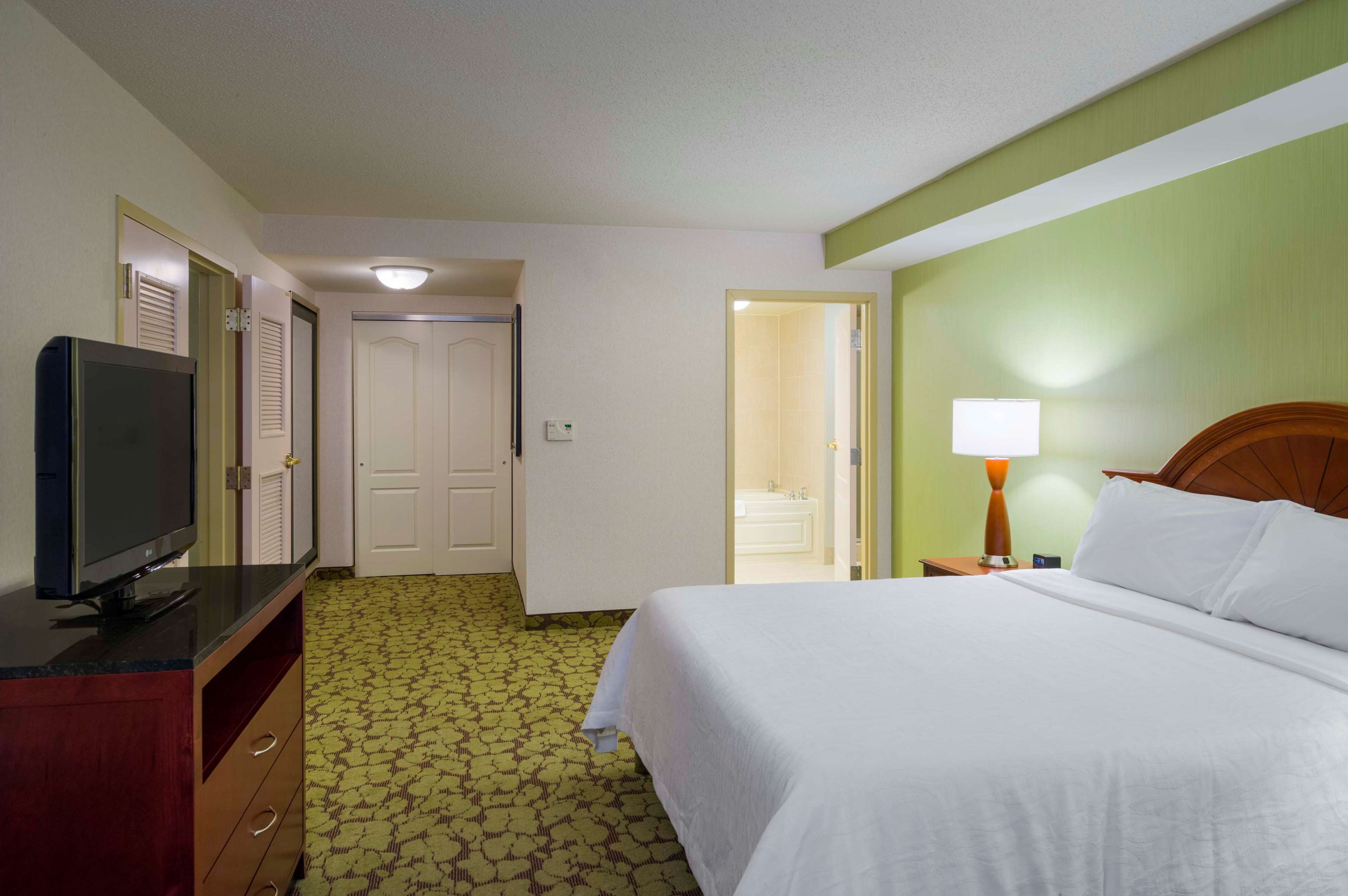 suite, 1 bedroom, jetted tub | select comfort beds, in-room safe, desk, iron/ironing board