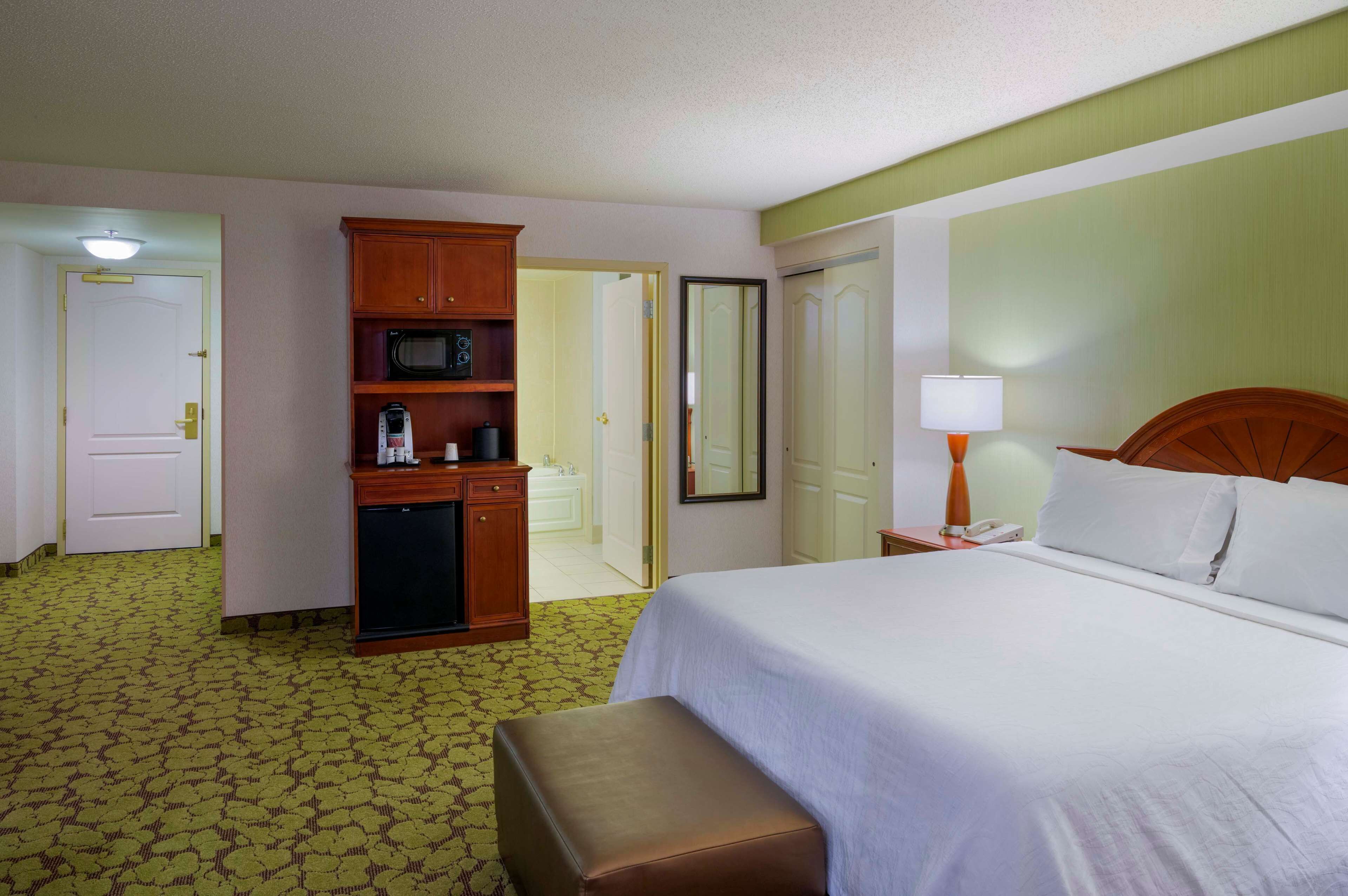 suite, 1 bedroom, jetted tub | select comfort beds, in-room safe, desk, iron/ironing board