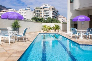 Outdoor pool, open 8:00 AM to 8:00 PM, pool umbrellas, pool loungers