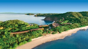 A coastal resort with beachfront villas, lush greenery, and a clear view of the ocean. - Four Seasons Resort Peninsula Papagayo, Costa Rica (Nacascolo)