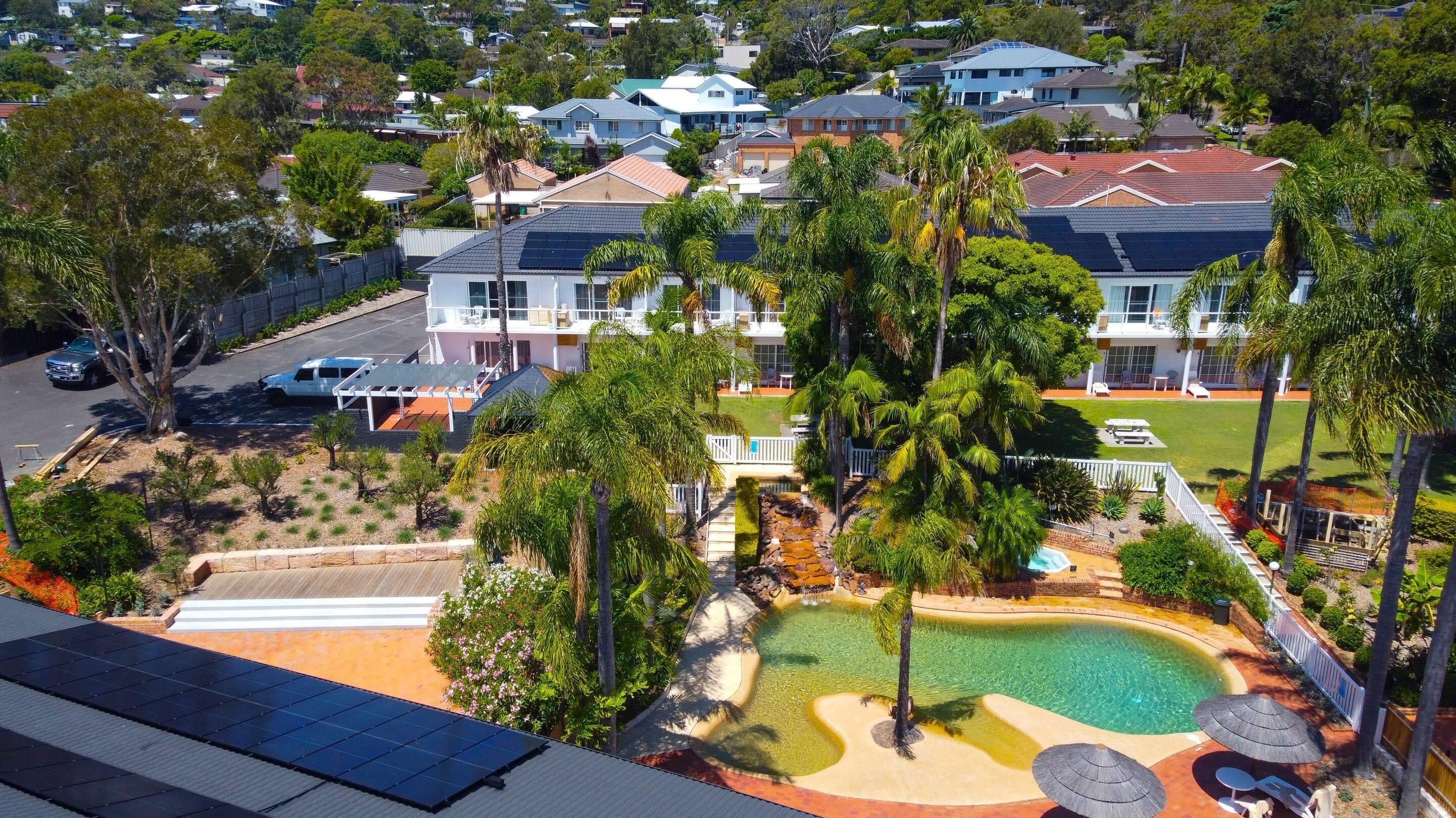 Outdoor pool, open 8 AM to 8 PM, pool loungers