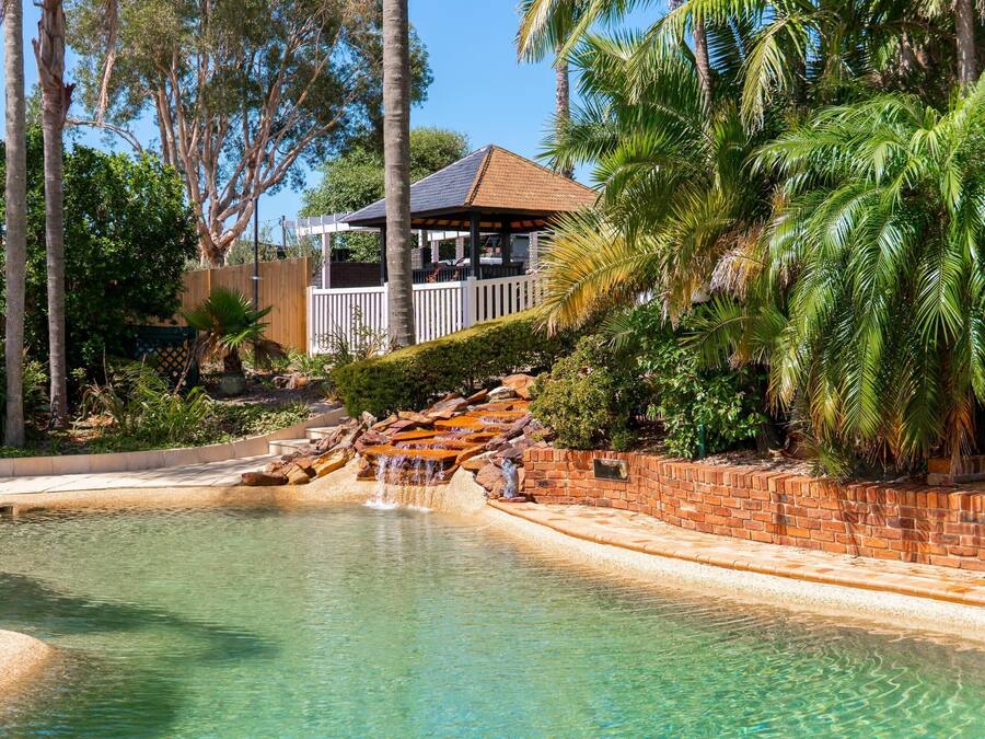 Outdoor pool, open 8 AM to 8 PM, pool loungers