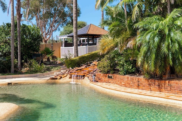 Outdoor pool, open 8 AM to 8 PM, pool loungers