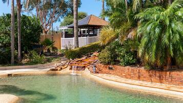 Outdoor pool, open 8 AM to 8 PM, pool loungers