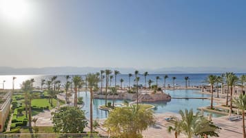 8 outdoor pools, pool umbrellas, sun loungers