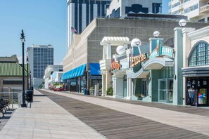 A boardwalk with shops, including a Pink Bunny and a casino.