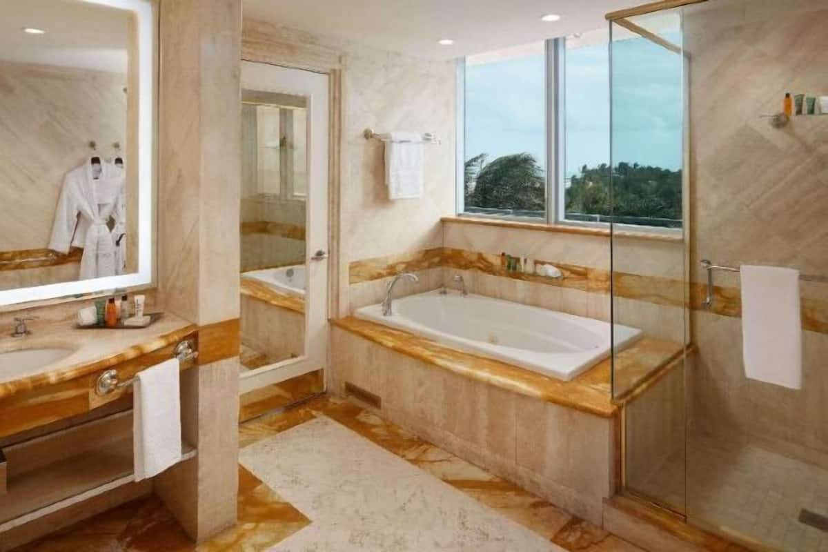 Bathroom | Eco-friendly toiletries, hair dryer, bathrobes, slippers