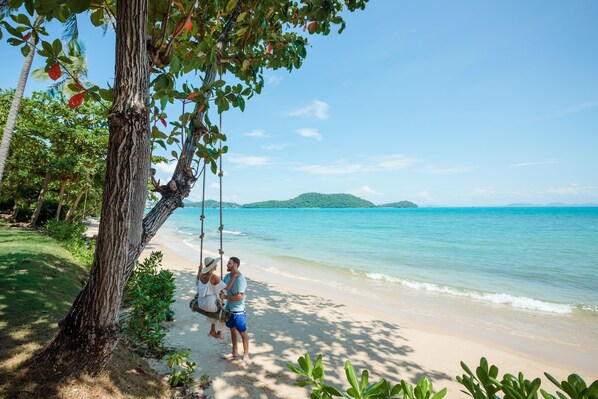 Private beach, white sand, sun loungers, beach umbrellas