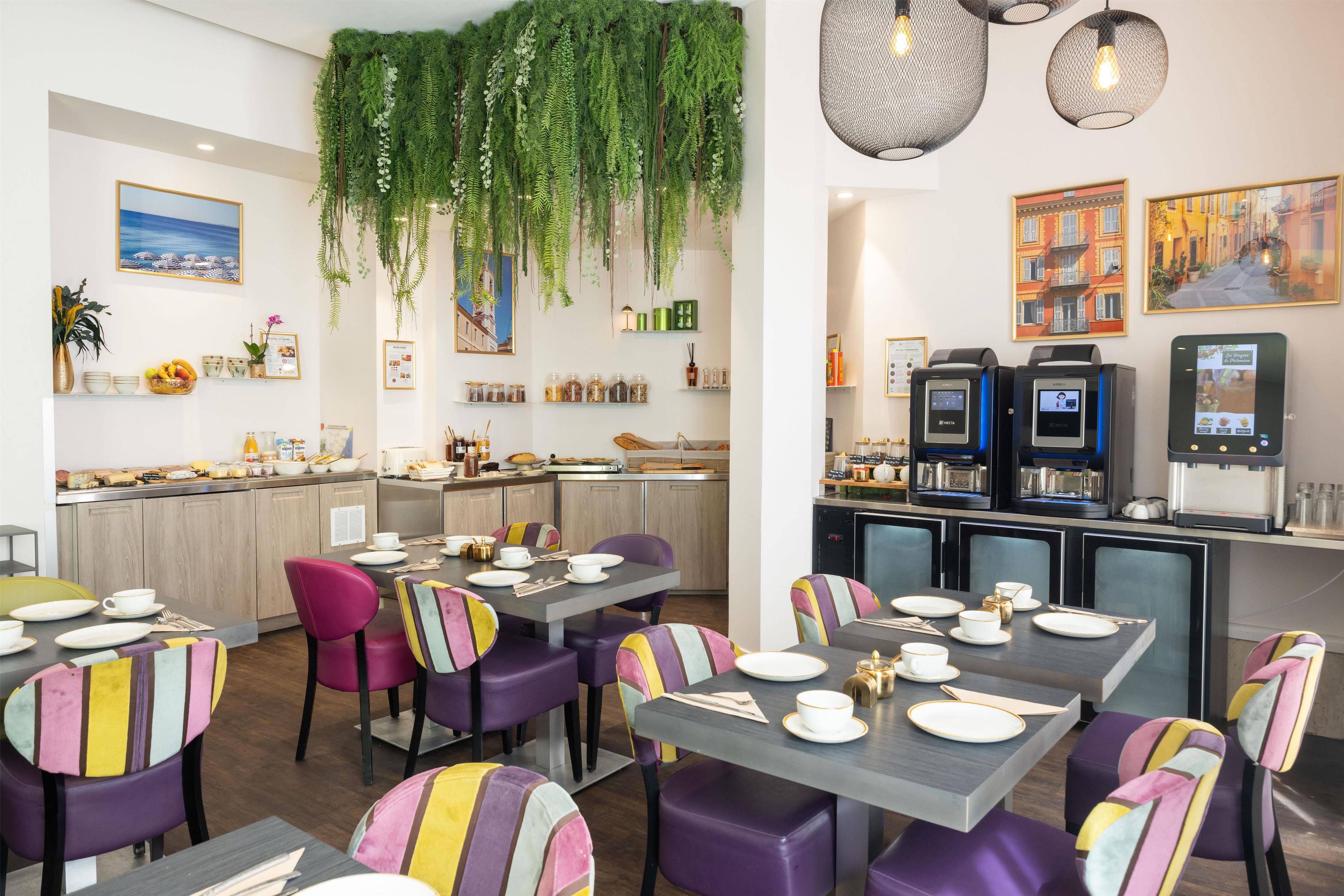 A restaurant interior with tables set for dining, a bar area, and a coffee machine.