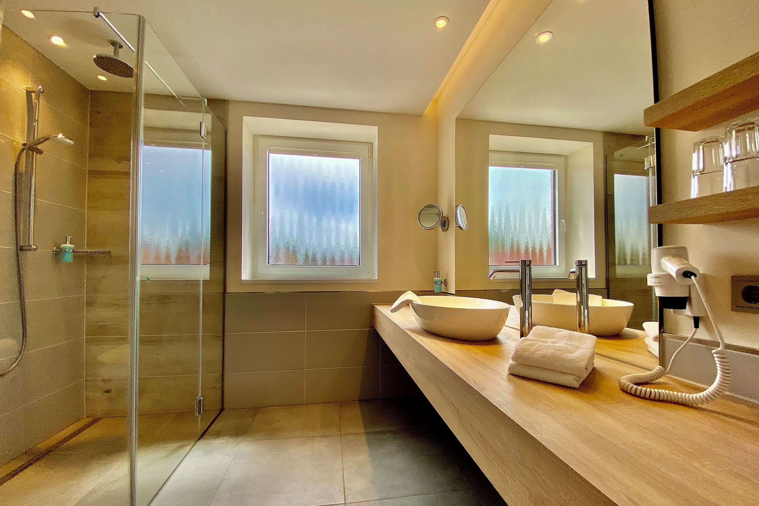 junior suite | bathroom | hair dryer, bathrobes, towels