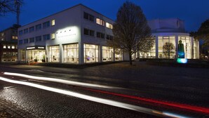 A modern hotel with a glass facade, multiple floors, and a well-lit entrance. - Elite Park Hotel Växjö (Växjö)