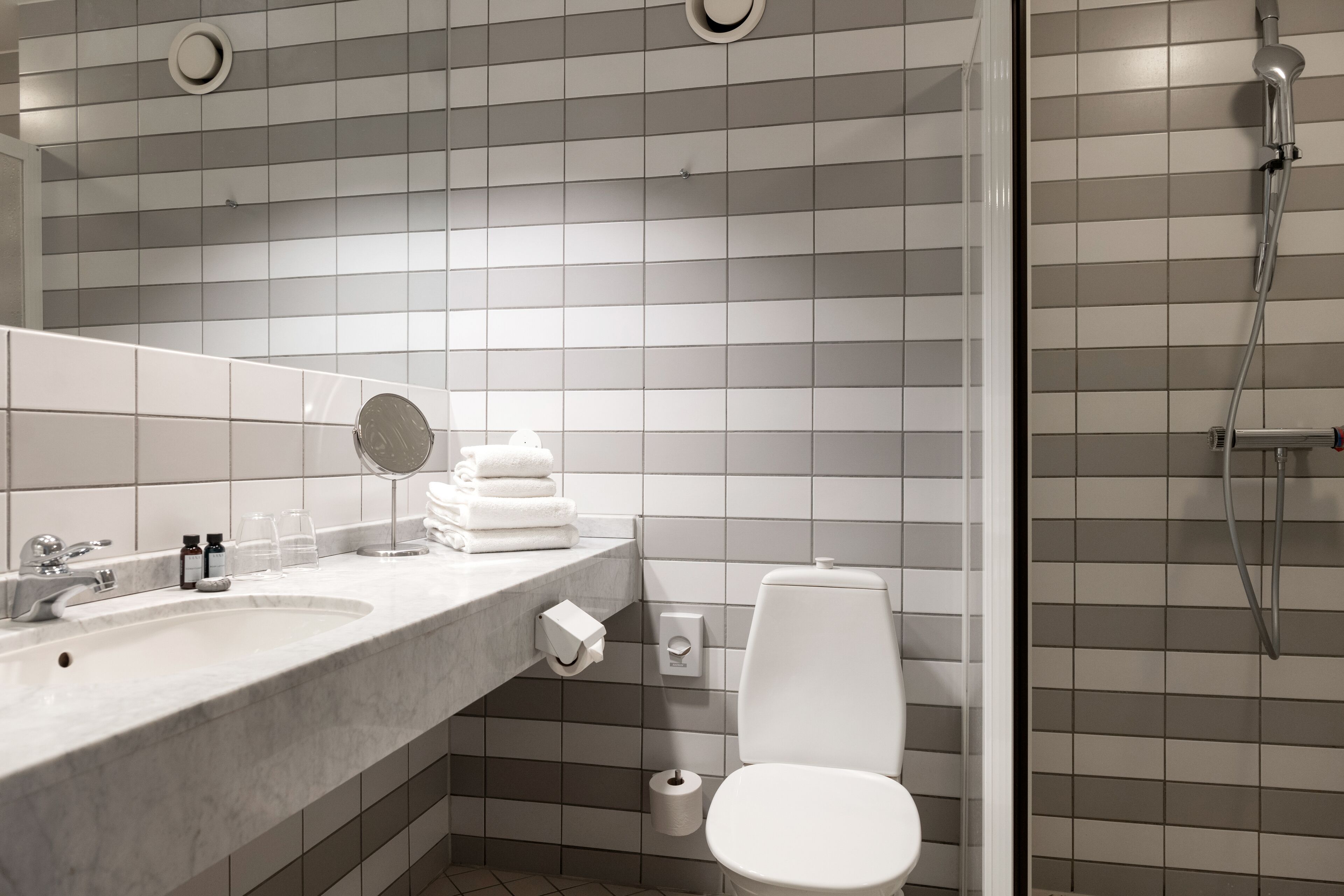 superior room | bathroom | shower, hair dryer, towels