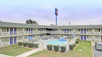 Seasonal outdoor pool, open 11:00 AM to 9:00 PM, pool umbrellas