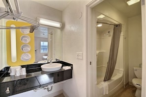 Combined shower/tub, towels, soap, toilet paper