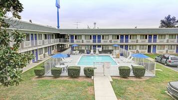 Seasonal outdoor pool, open 11:00 AM to 9:00 PM, pool umbrellas