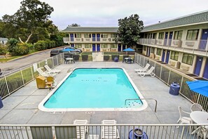 Seasonal outdoor pool, open 11:00 AM to 9:00 PM, pool umbrellas