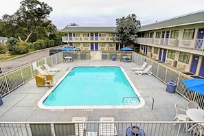 Seasonal outdoor pool, open 11:00 AM to 9:00 PM, pool umbrellas