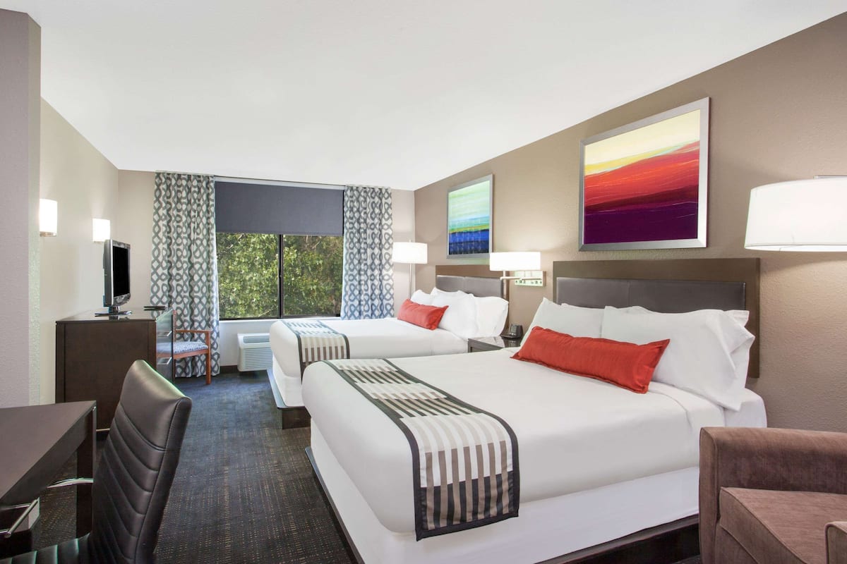 premium bedding, pillow-top beds, desk, laptop workspace