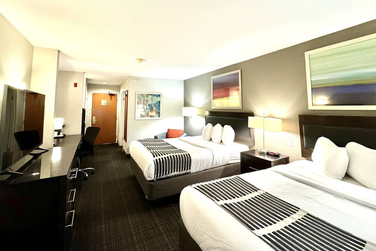 premium bedding, pillow-top beds, desk, laptop workspace