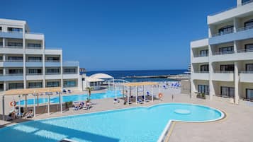 Comfort Quadruple Room, Pool View | Minibar, in-room safe, desk, free WiFi