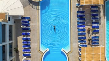 Indoor pool, seasonal outdoor pool, pool umbrellas, pool loungers