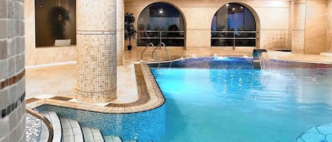 Indoor pool, seasonal outdoor pool, pool umbrellas, pool loungers