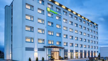 A multi-story hotel with a flat facade, large windows, and a Holiday Inn Express sign.