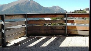 A balcony with a view of a mountain.