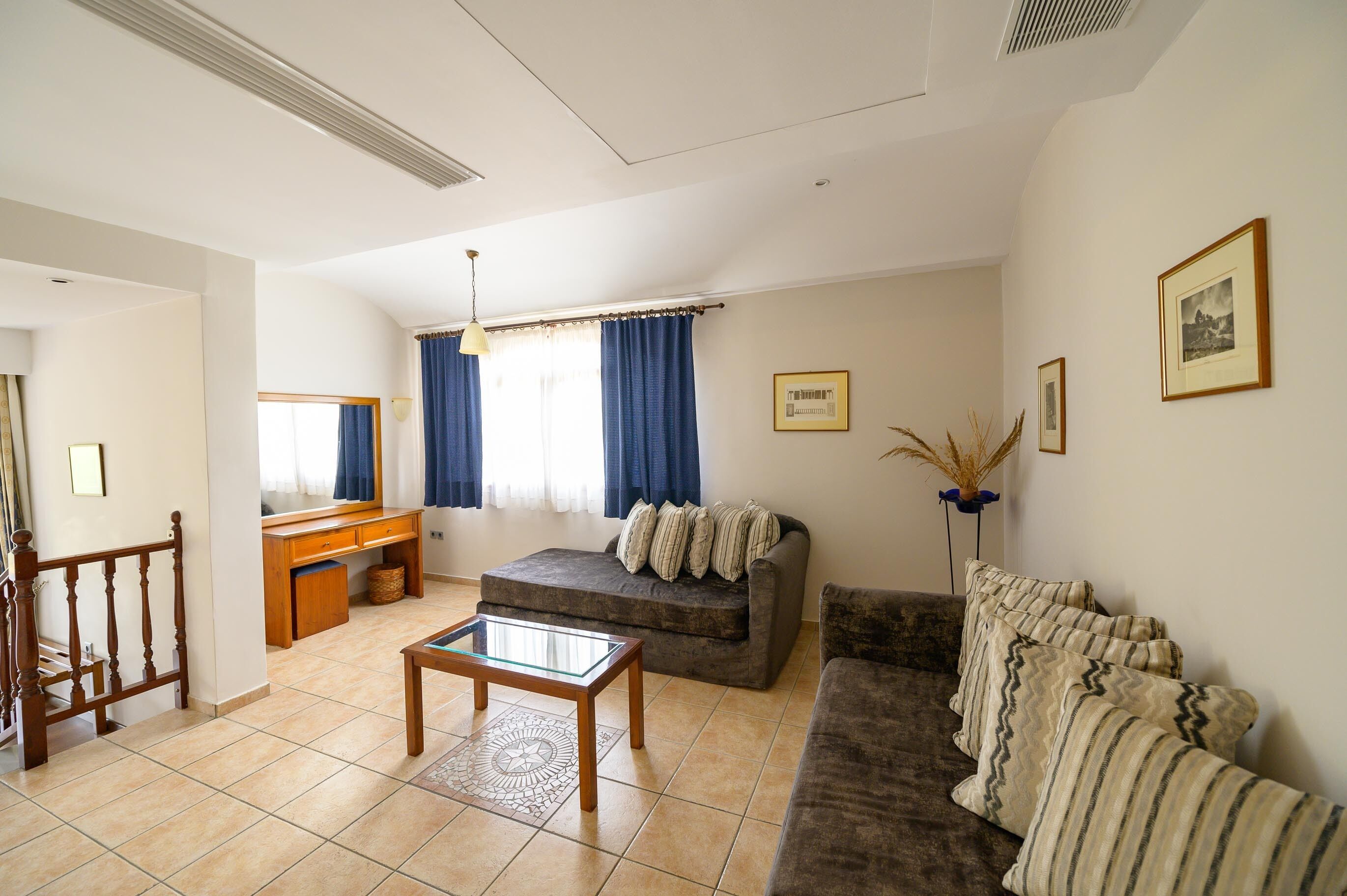 junior studio suite, non smoking, pool view | living area | flat-screen tv