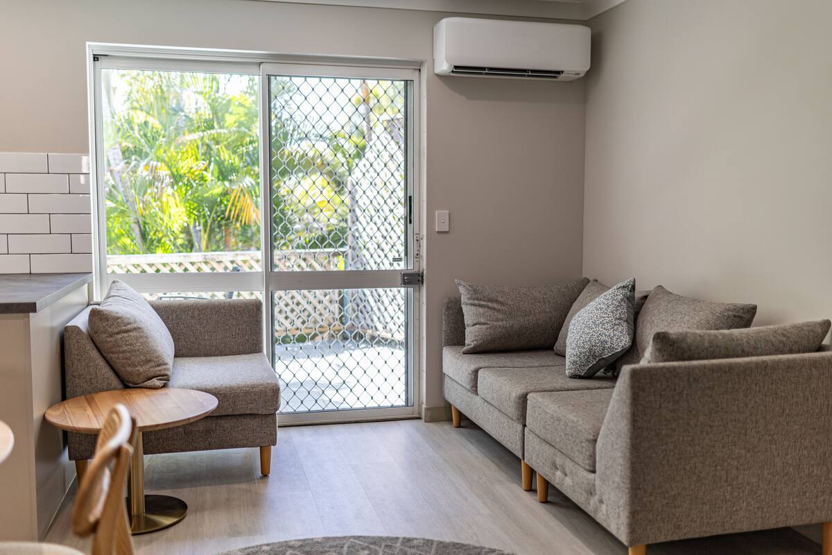 superior two bed apartment | living area | lcd tv