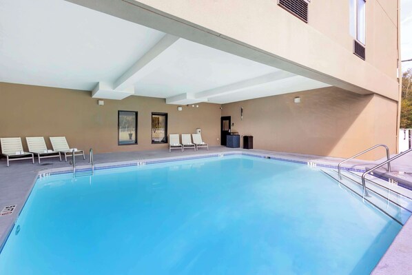 Seasonal outdoor pool, open 8:00 AM to 10:00 PM, pool umbrellas