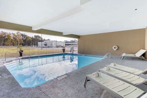 Seasonal outdoor pool, open 8:00 AM to 10:00 PM, pool umbrellas
