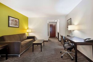 Premium bedding, desk, laptop workspace, blackout drapes