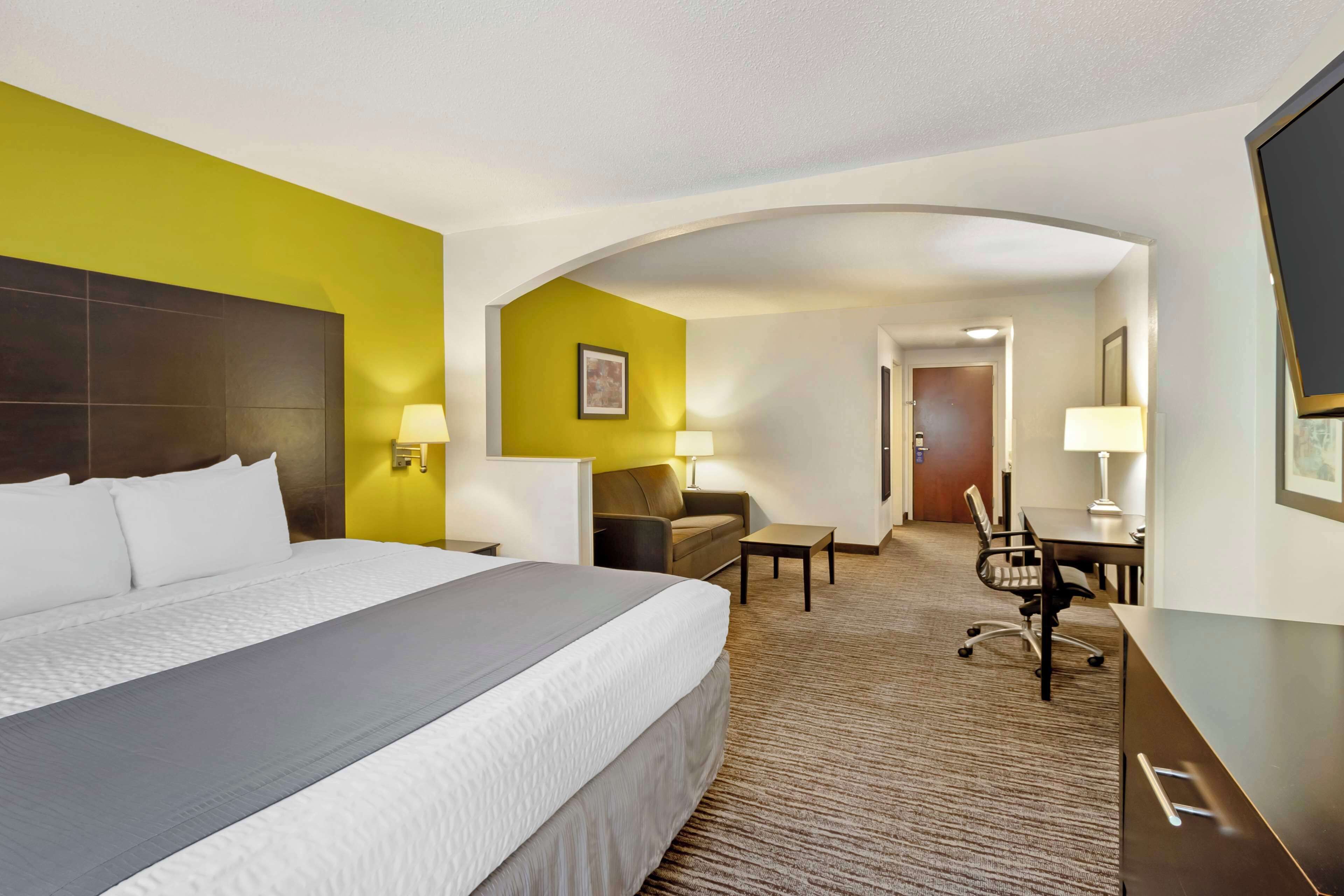 Premium bedding, desk, laptop workspace, blackout curtains