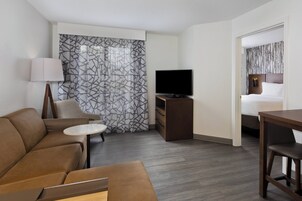 Suite, 1 Bedroom | Living area | 37-inch flat-screen TV with cable channels, TV, fireplace