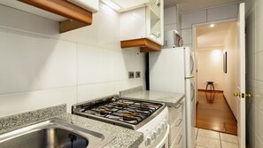 Microwave, toaster, cookware/dishes/utensils, dining tables
