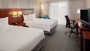 A hotel room with two beds, a desk with a TV, a chair, and a lamp. - Courtyard Fort Worth I-30 West Near Naval Air Station-JRB (Fort Worth)