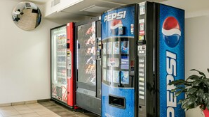 A vending machine area with Pepsi and Coca-Cola machines.