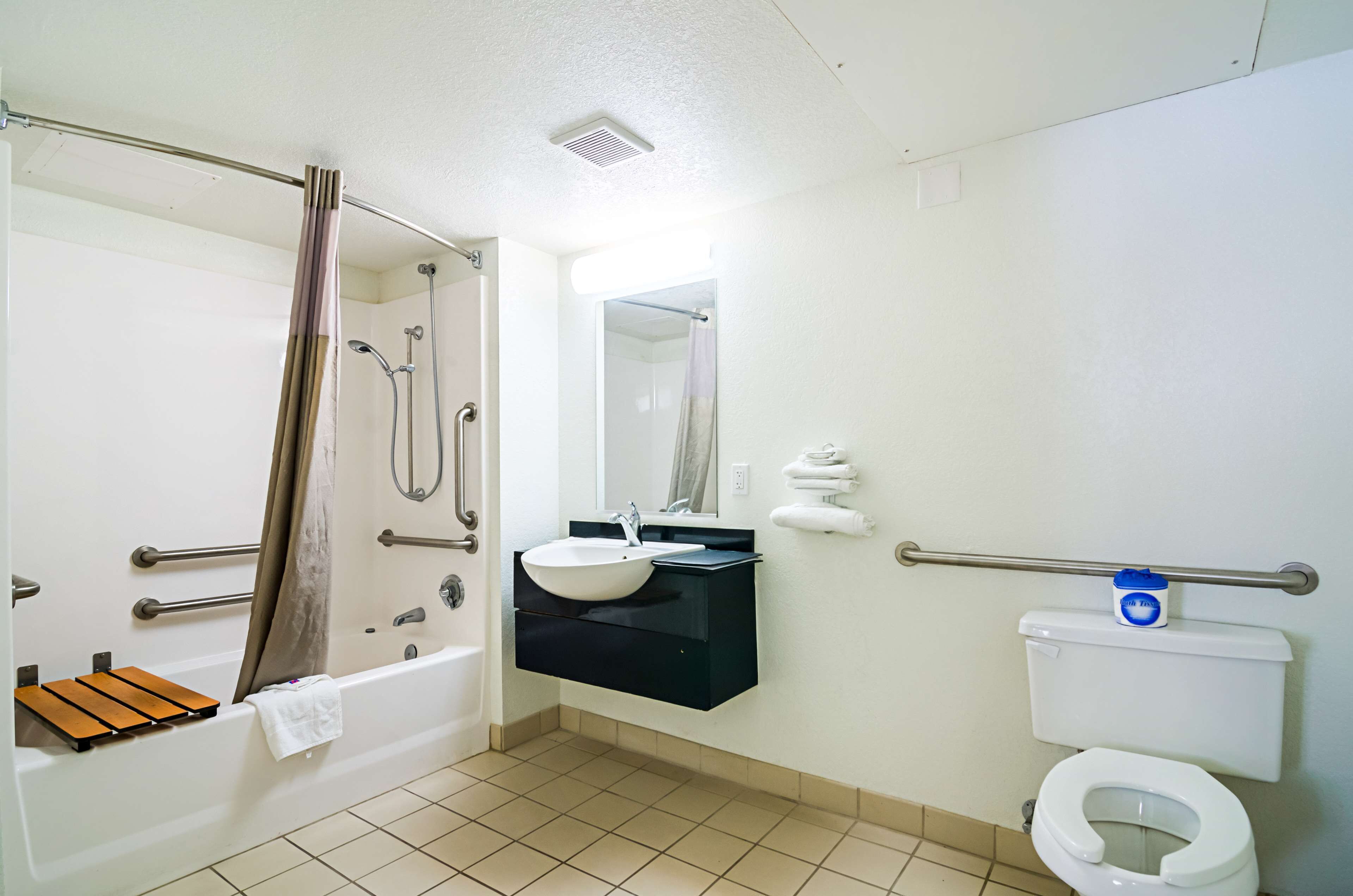 A bathroom with a bathtub, a sink, a toilet, and a shower.