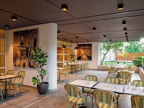 Breakfast, lunch, dinner served; international cuisine, garden views