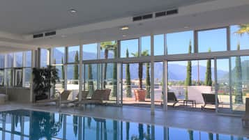 Indoor pool, open 6:00 AM to 9:30 PM, pool loungers